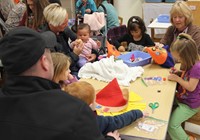 people working on scarecrow hats