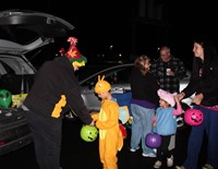 students getting candy at trunk or treat