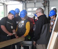 student working with hammer