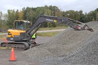 machinery digging into gravel