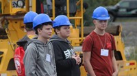 students watching machinery