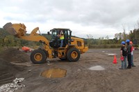 wide shot of students watching machinery