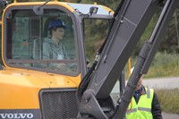 medium shot of student working on machinery