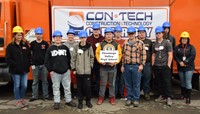 students in front of truck