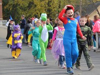 group of students walking in halloween costumes