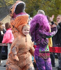 two students wearing halloween costumes