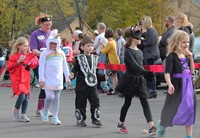 students walking dressed in halloween costumes