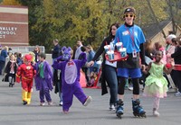 students and teachers walking in halloween parade