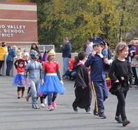 group of students parading in halloween costumes