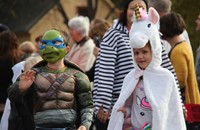 two students wearing halloween costumes