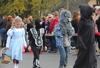 students walking in halloween costumes