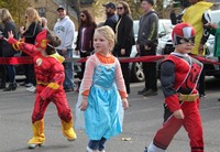 students parading in halloween costumes