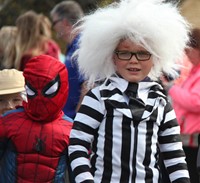 two students wearing halloween costumes