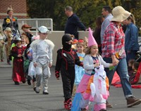 students and teacher parading in halloween costume