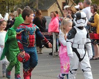 group of students wearing halloween costumes