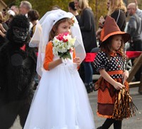 students parading in halloween costumes