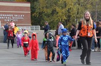 students and teachers walking in halloween parade