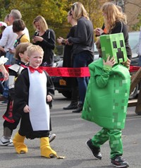 students walking wearing costumes