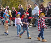 students dressed as scare crows parading