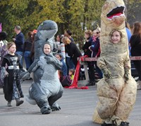 students in dinosaur costumes