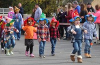 students parading in scare crow hats