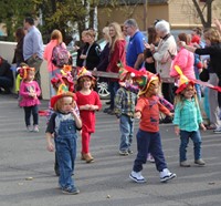 group of students parading wearing scare crow hats