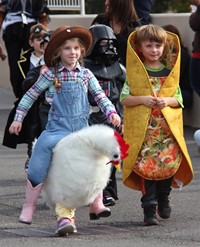 two students wearing halloween costumes