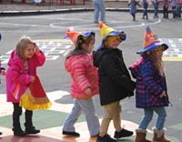 students wearing scare crow hats in parade