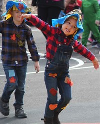 student acting like a scare crow in parade