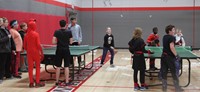 students playing ping pong