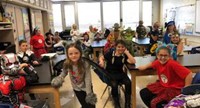 students dressed in costumes in classroom