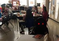 students dressed in halloween costumes in classroom