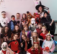 class of students in halloween costumes