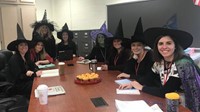 group of teachers dressed as witches for halloween