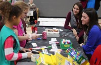 teachers and students at activity table