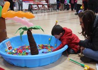 student and adult taking part in activity