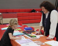 student coloring at activity station