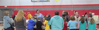 wide shot of people at girl scouts activity table