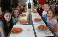 students at table with thanksgiving treats