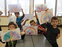 students holding up thanksgiving pictures