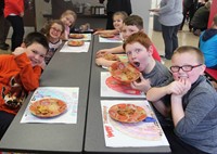 students at lunch table with thanksgiving treats