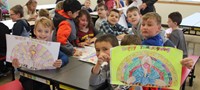 more students holding up thanksgiving pictures