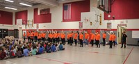 wide shot of students performing for p d students