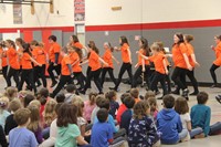 students performing for p d students