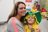 woman and child wearing scarecrow hat