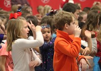 close up of students signing song