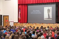 student speaking at veterans day assembly