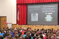 student speaking during veterans day assembly