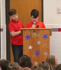 up close of student speaking at veterans day assembly