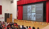 student speaking during veterans day assembly